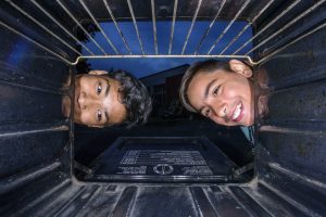 Mohammed, from Afghanistan, and Nemanja, from Serbia, trick the cam trap pretending to be a fox peeking into an oven.